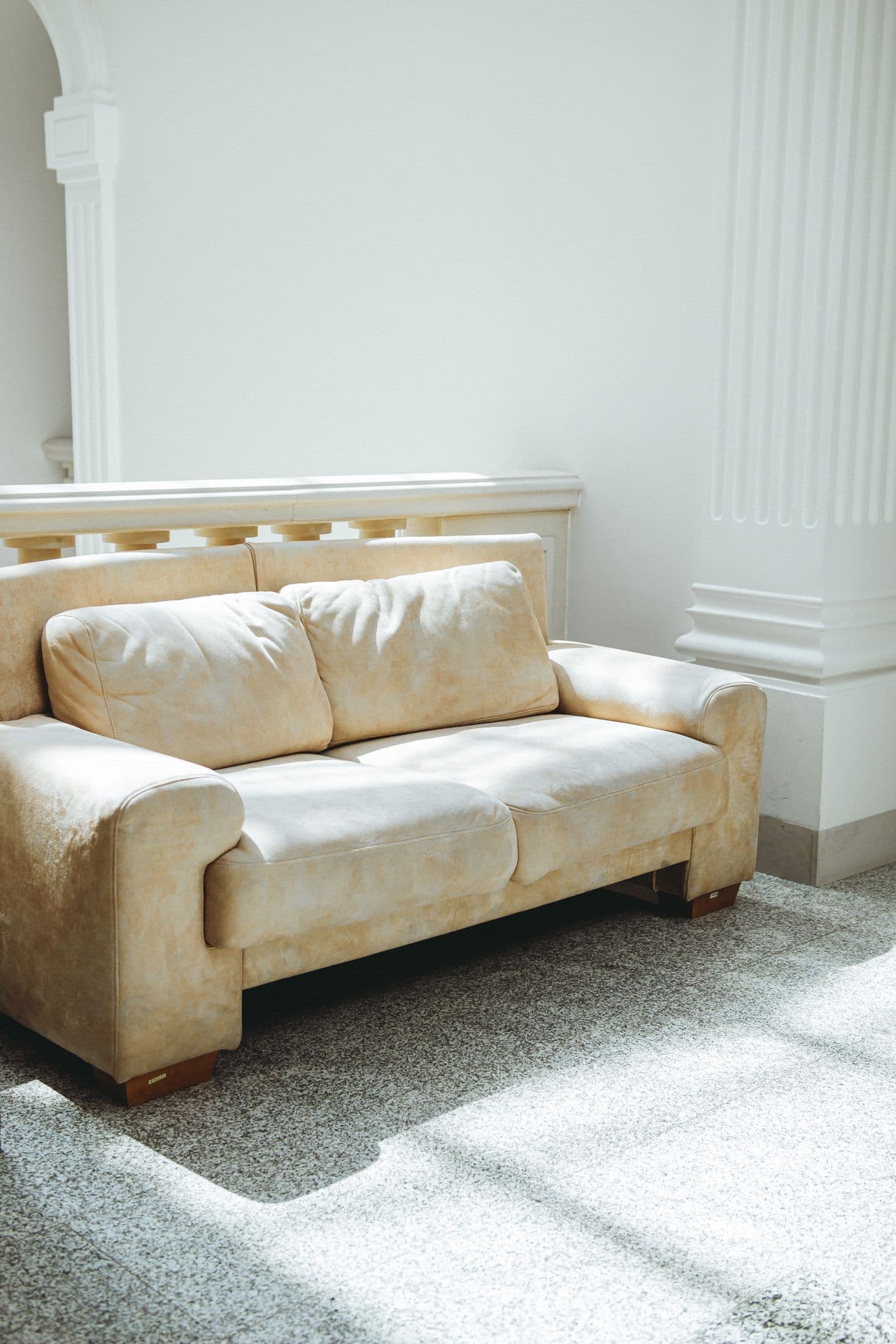 A living room with a fabric sofa